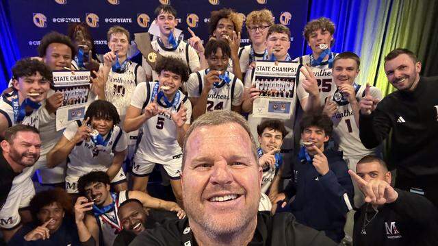 The San Joaquin Memorial boys basketball team poses for a photo after winning the CIF Division II state championship in Sacramento on Saturday, March 14, 2026.